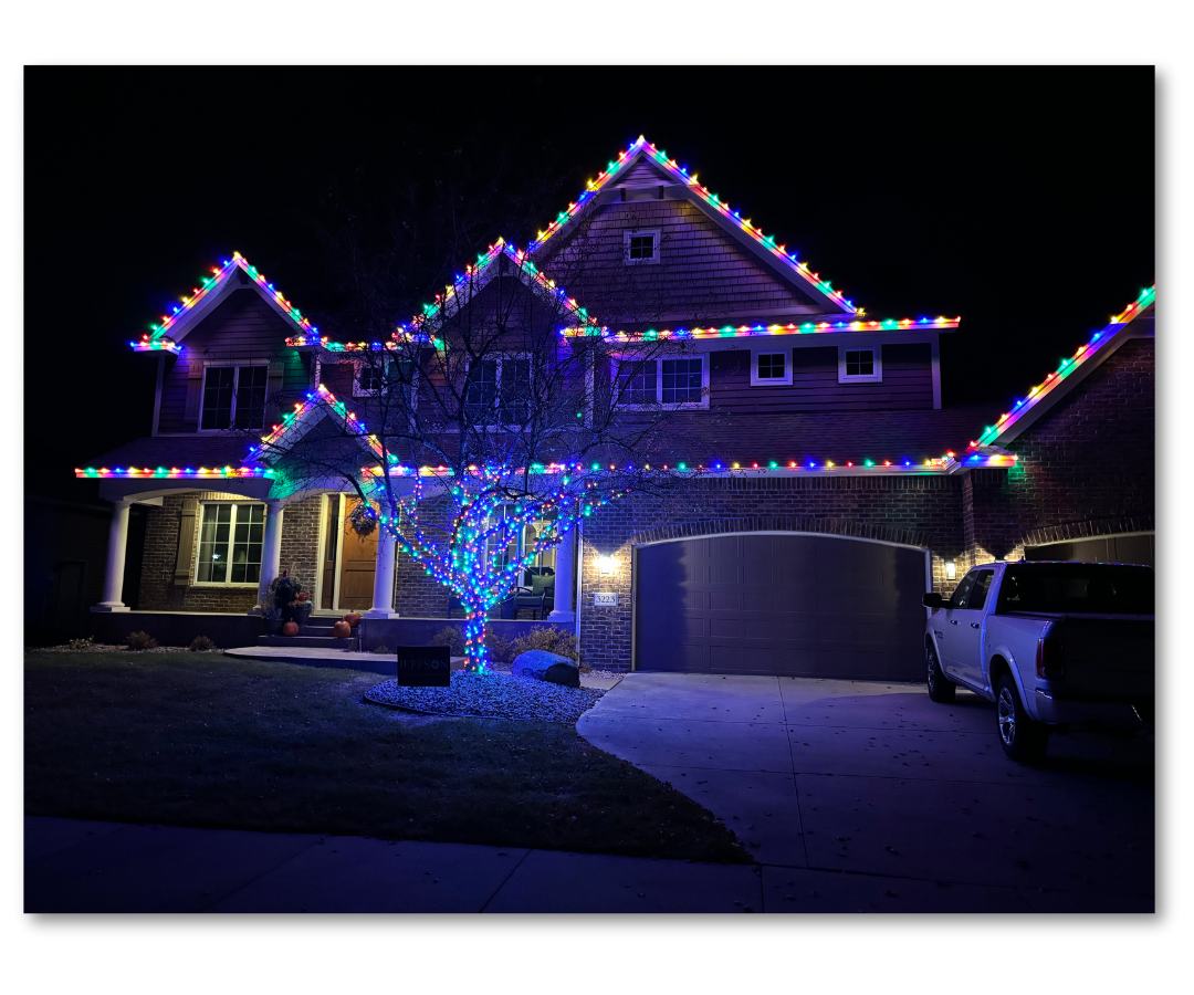 Orland Park area home with clean warm-white roofline lighting on a winter evening